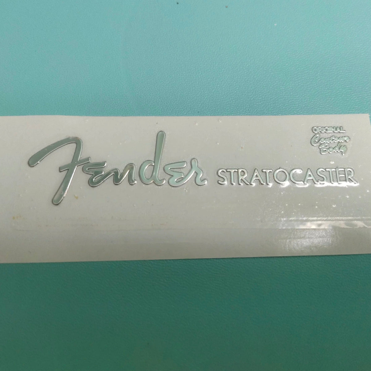 Guitar Head Silver Logo Metal Label UV Adhesive Tear off Film Leave Words - Fender ST